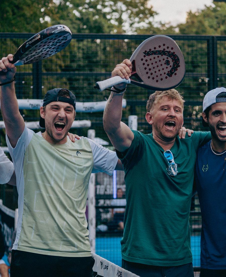 Players celebrating on court after a match